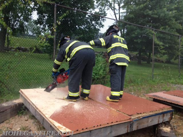 Probationary Firefighters Performing Roof Ventilation Training At Westchester County Fire Training Center On 7/15/14